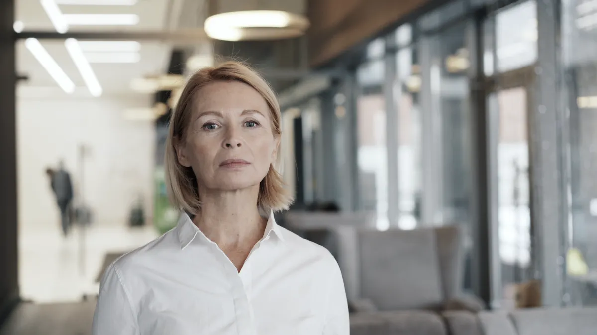 A person in their fifties reviewing consolidated pensions